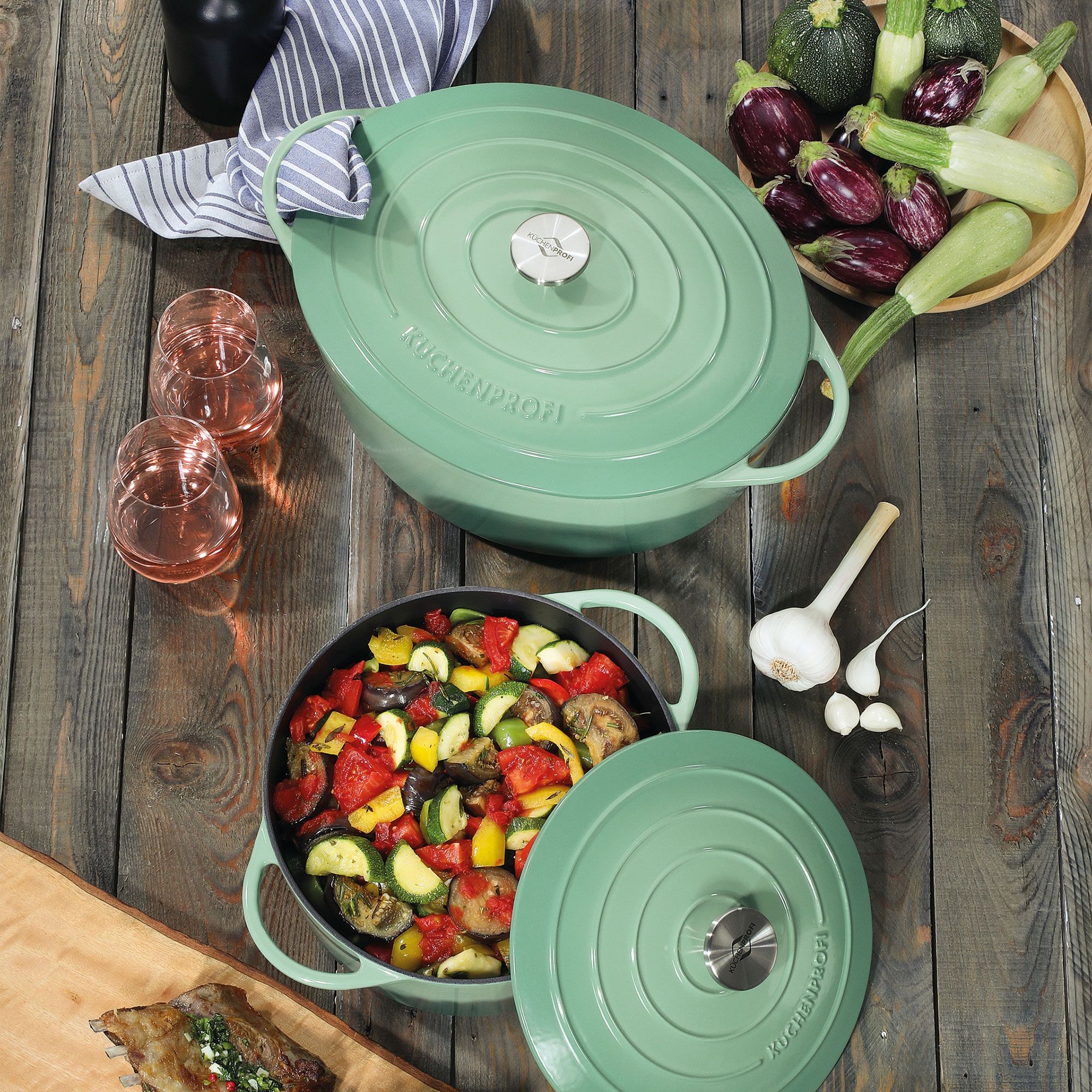 Round green casserole with ratatouille vegetables